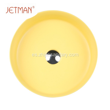 Fregadero redondo de color amarillo con lavabo de cerámica